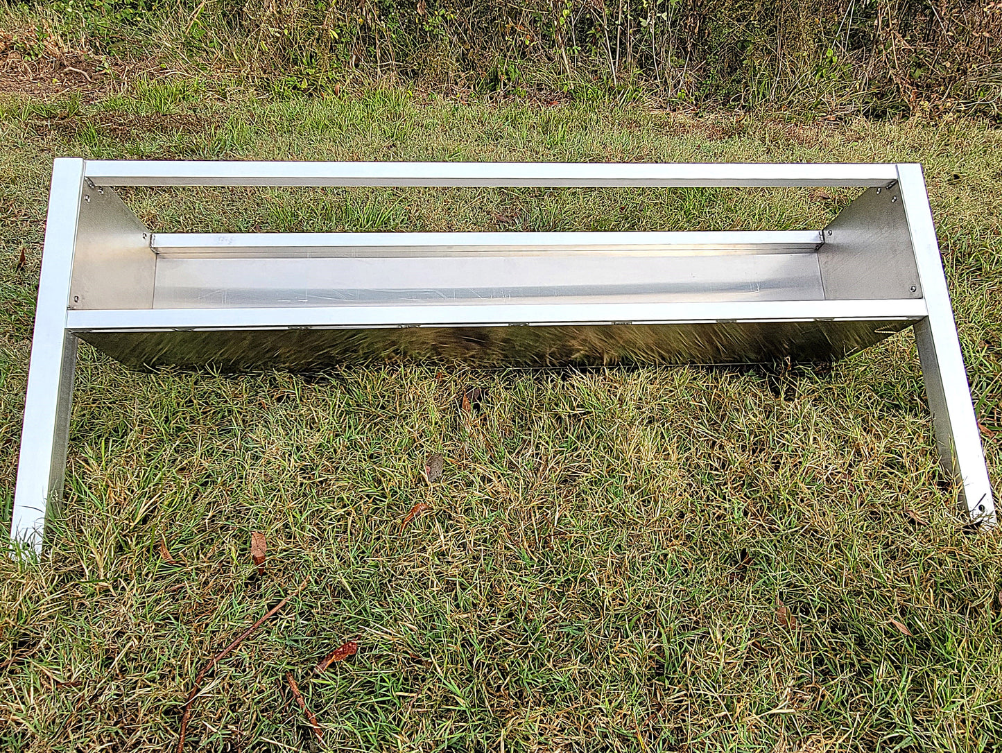 48-inch welded aluminum sheep and goat V trough feeder with anchors, ideal for livestock feeding, made in the USA.
