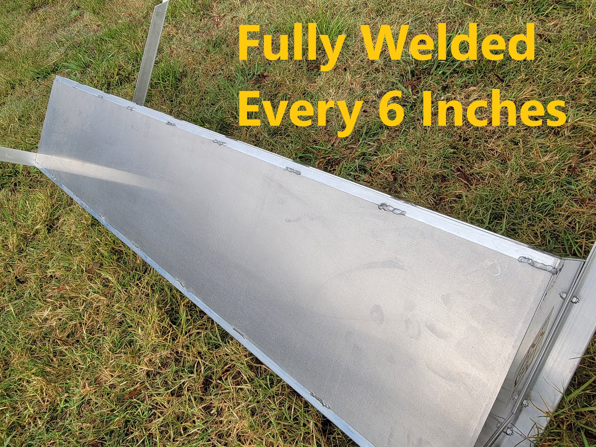 48-inch welded aluminum sheep and goat V trough feeder with anchors, ideal for livestock feeding, made in the USA.