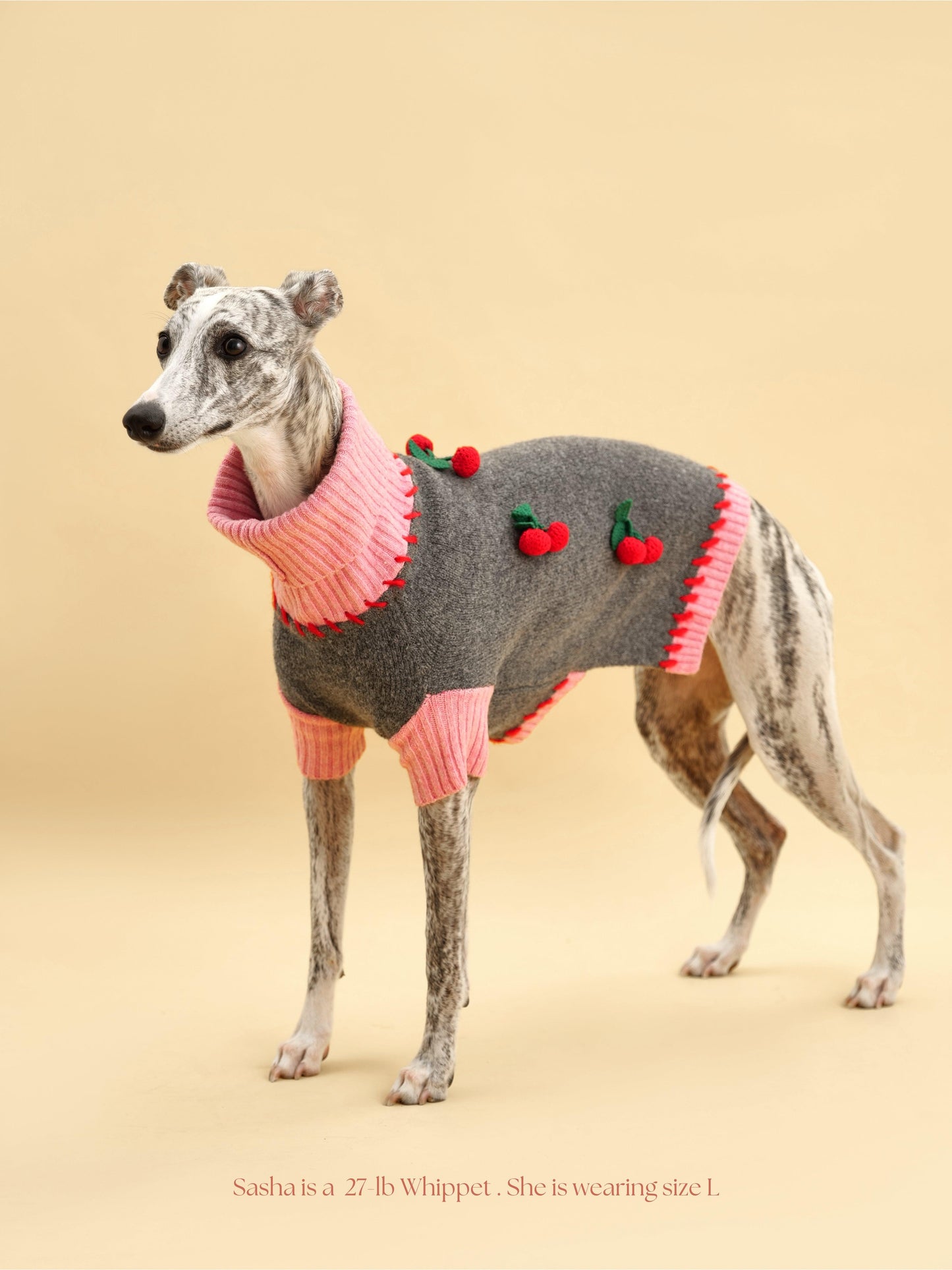 Cherry Kiss Sweater by BarkBarkBaby featuring a cozy knit design with cherry patterns in red and white for children.