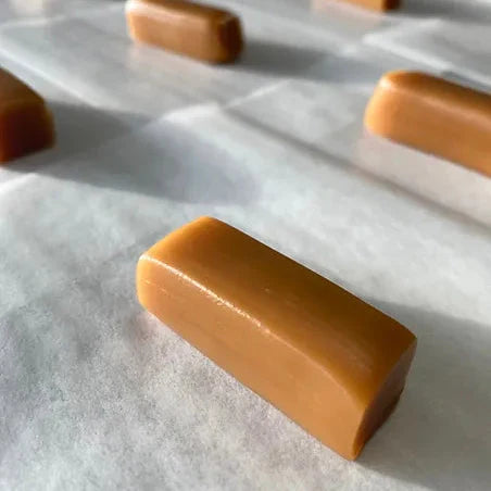 Box of Vanilla Caramels from Boxicanyon, featuring 12 creamy, golden vanilla-flavored caramel candies in a neat box.