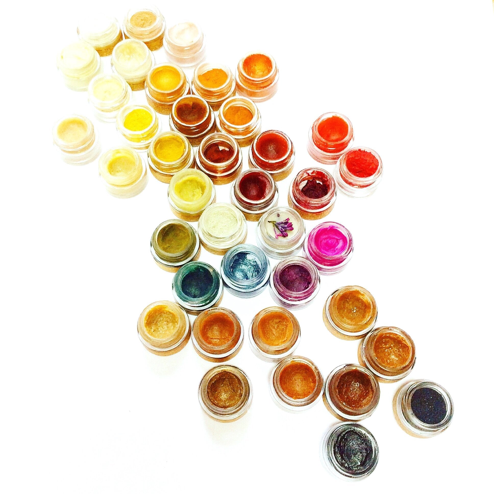 Plant Makeup Hibiscus and Beet Lip Tint in a sleek tube, featuring vibrant pink and red shades for natural lip color.