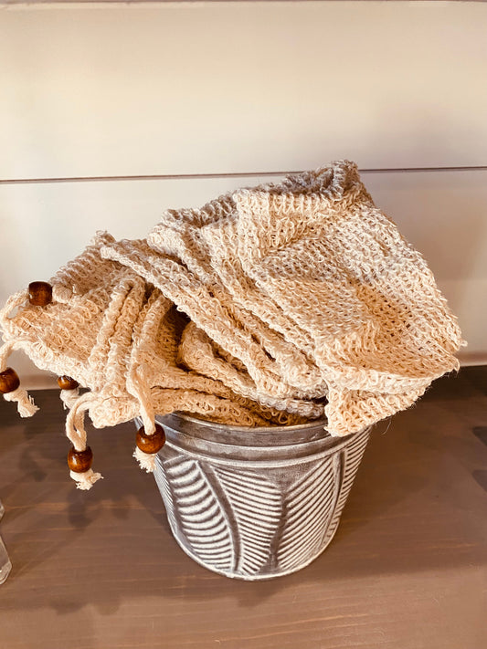 Natural sisal soap pouch from Onic Brands LLC, showing textured natural fiber material with drawstring closure.