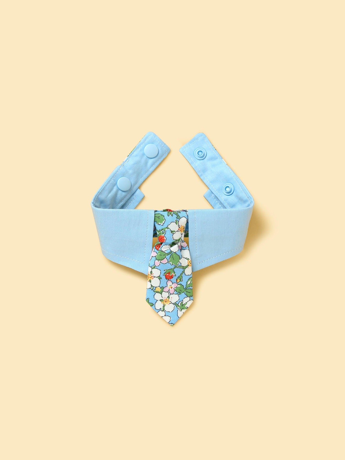 Blue Botanique necktie bandana by BarkBarkBaby featuring botanical print fabric for stylish pet accessory.