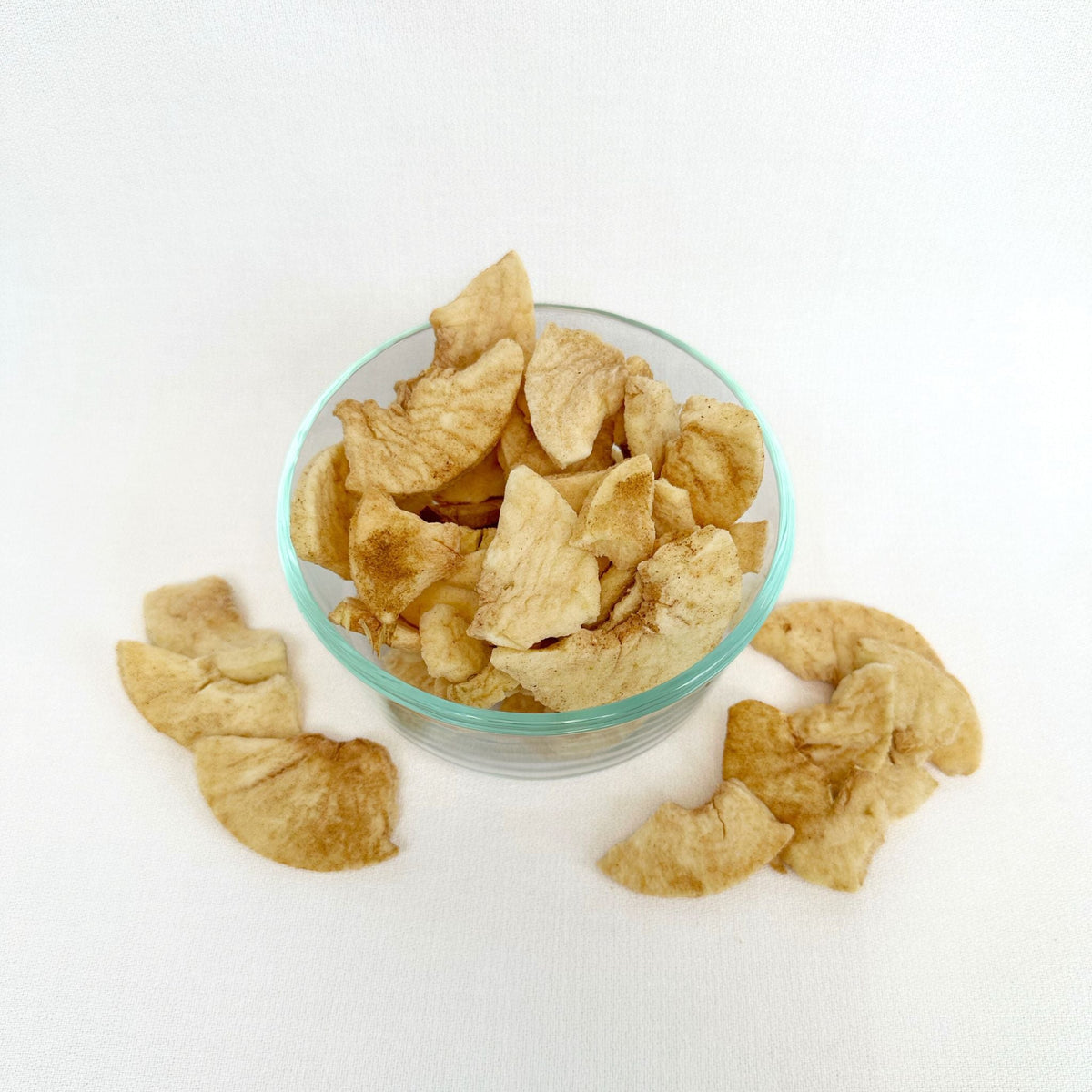 Freeze-dried Cinnamon & Sugar Apples from Double L Ranch, showing vibrant dried apple slices coated with cinnamon and sugar.
