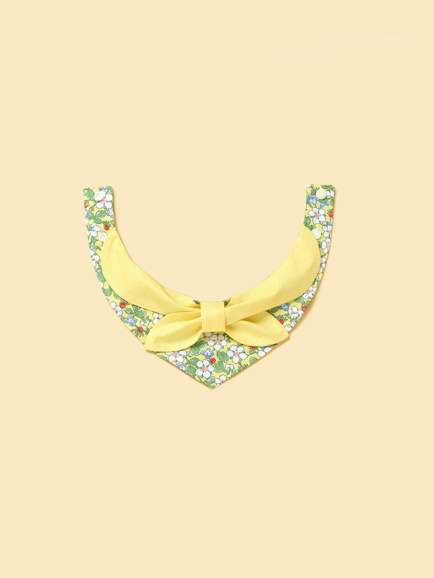 Yellow floral bandana for babies featuring a bowtie design, made by BarkBarkBaby, perfect for adorable garden-themed outfits.