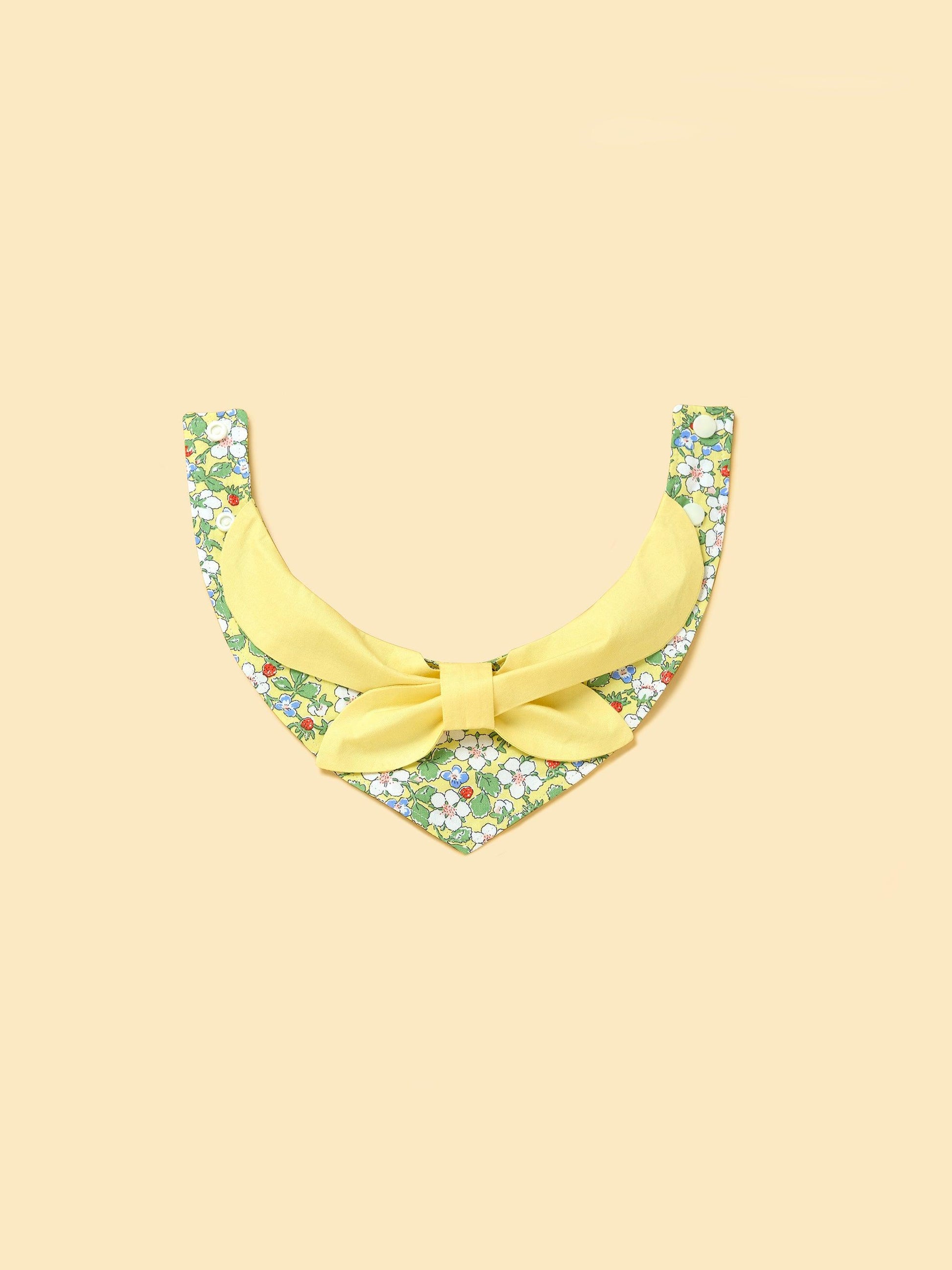 Yellow floral bandana for babies featuring a bowtie design, made by BarkBarkBaby, perfect for adorable garden-themed outfits.