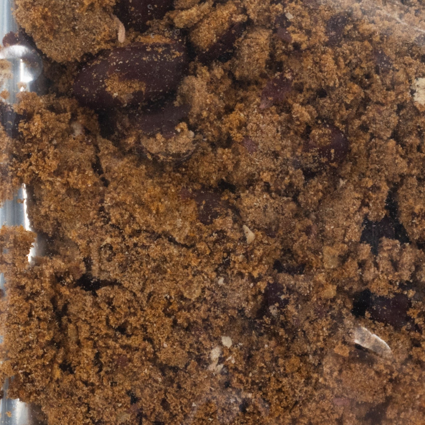 Freeze dried chili soup by Wicked Good Foods in a 2 oz package, displayed with chili ingredients and seasoning in a natural setting.