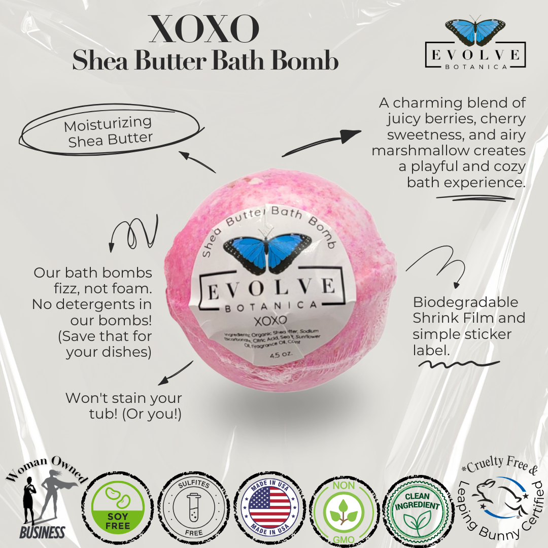 Evolve Botanica XOXO bath bomb, round and colorful with floral and heart patterns, ready for a relaxing bath.