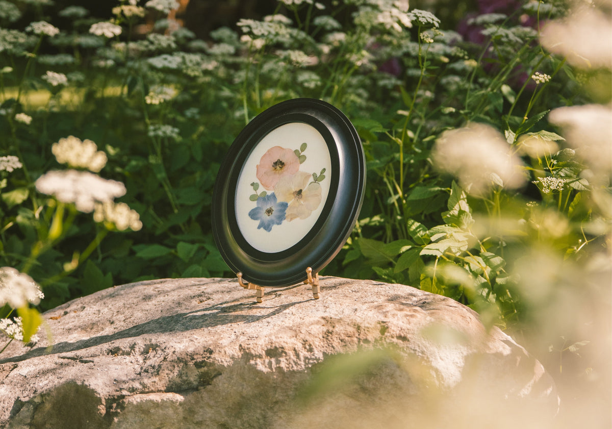 Pressed Floral boutonniere frame with preserved flowers and greenery, perfect for wedding or special occasion floral arrangements.
