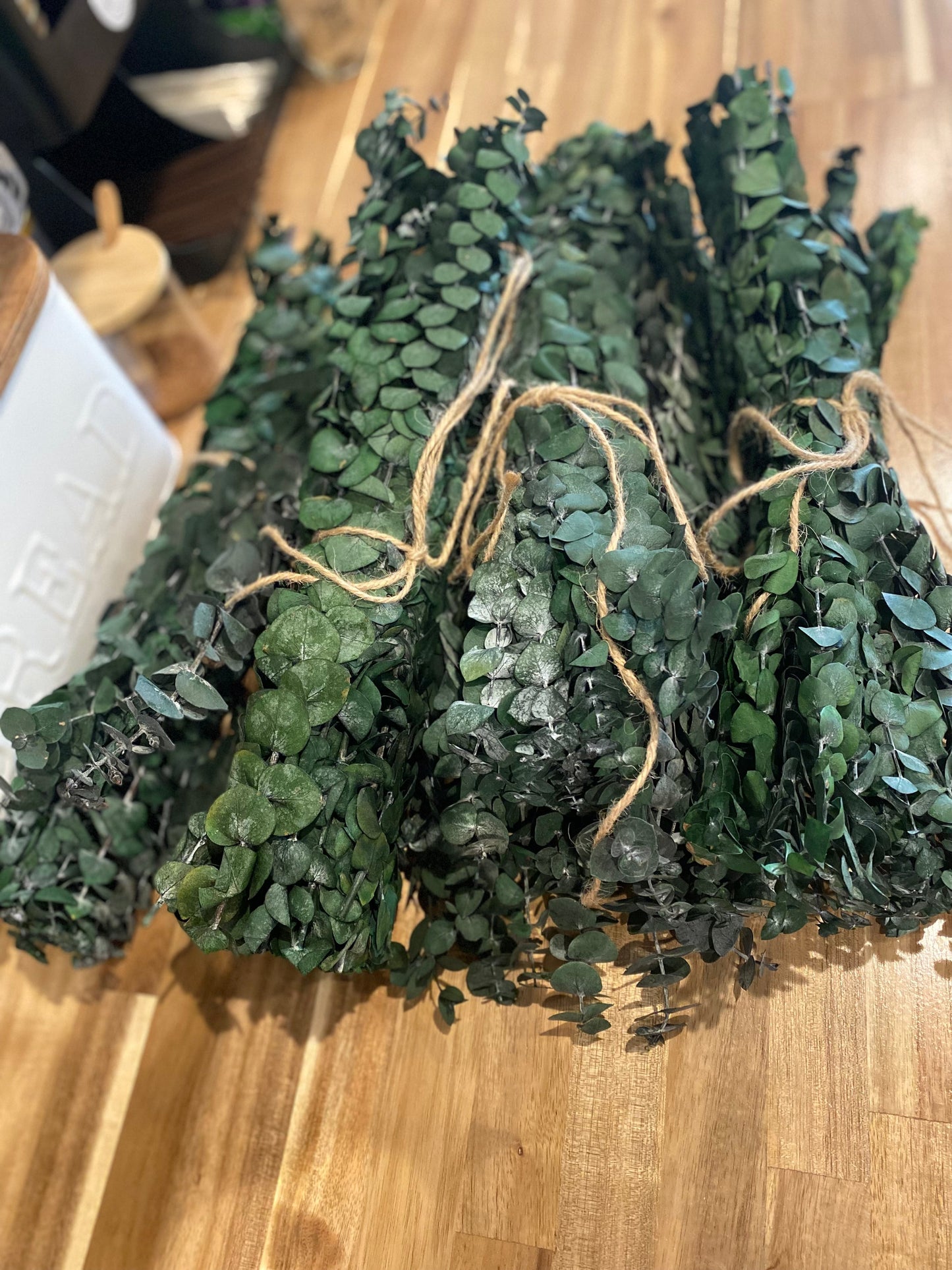 Onic Brands LLC hanging eucalyptus decorative plant with realistic green leaves in a natural-looking arrangement.