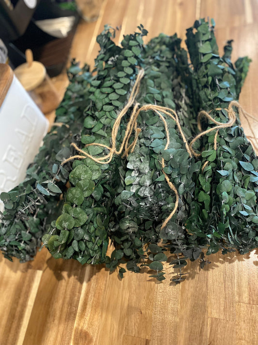 Hanging eucalyptus plant from Onic Brands LLC with realistic green leaves, ideal for home decor or floral arrangements.