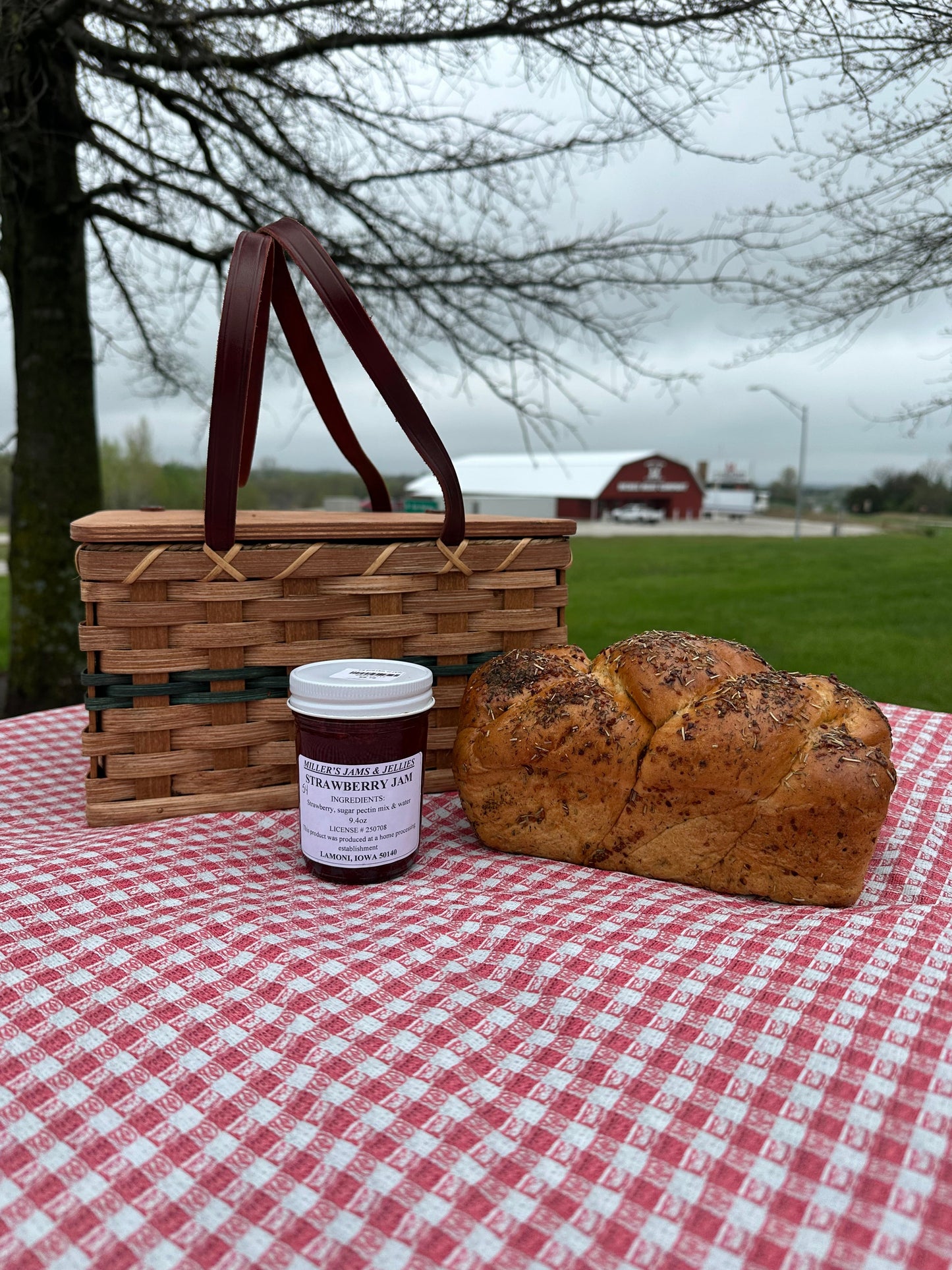 Amish Country Store Amish strawberry jam jar with fresh strawberries, showcasing traditional Amish-made Amish jam.