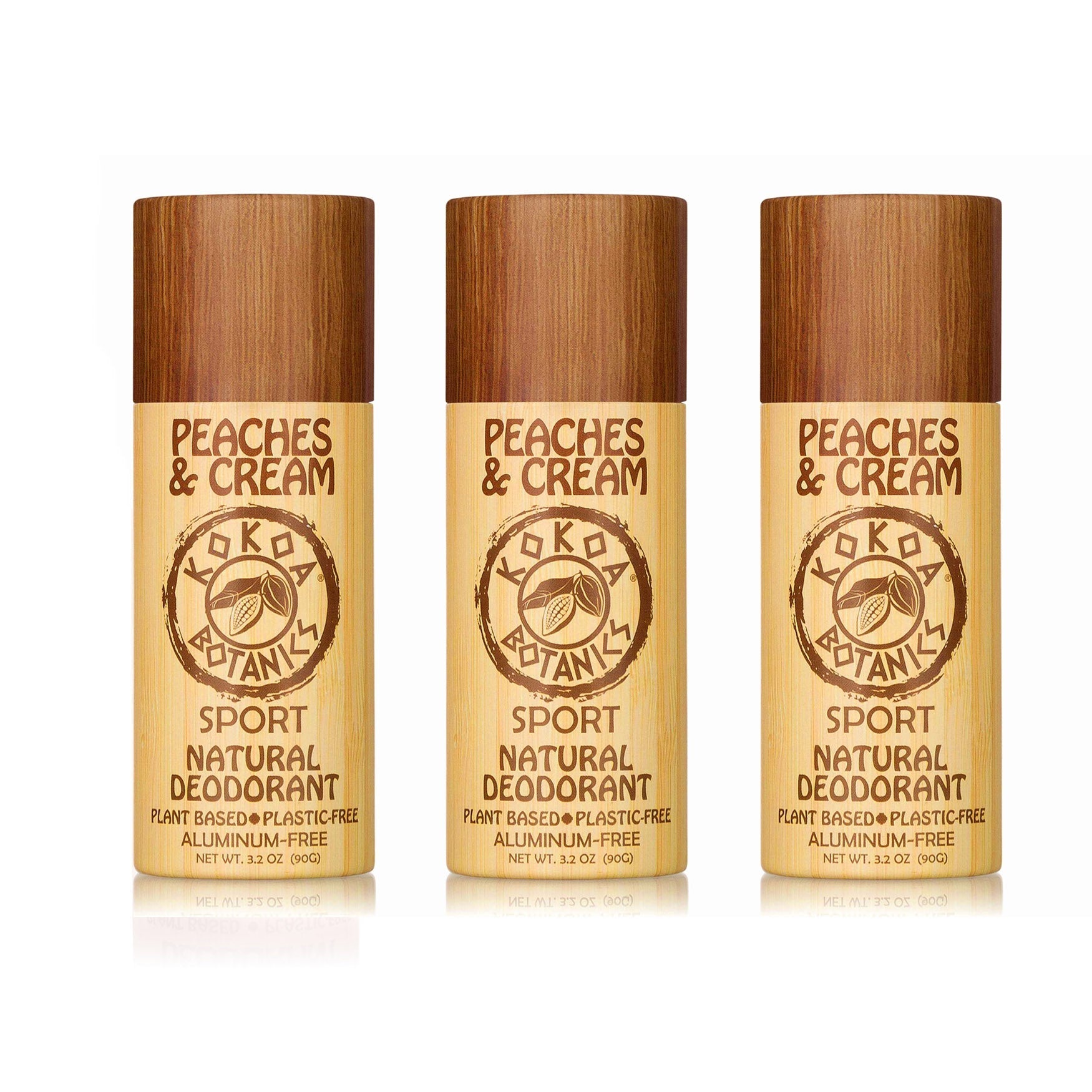 Three-pack of KOKOA BOTANICS natural deodorants in peach scent, aluminum-free, with white and peach packaging.
