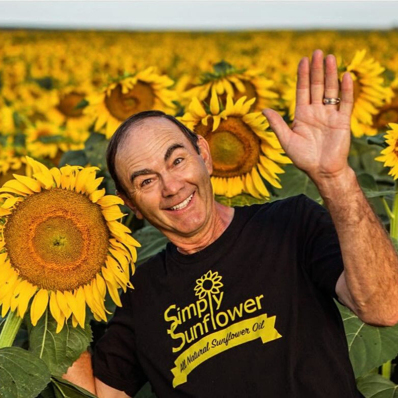 Bottle of Simply Sunflower sunflower oil in 8 oz size, non-GMO, gluten-free, nut-free, vegan food product on a plain background.