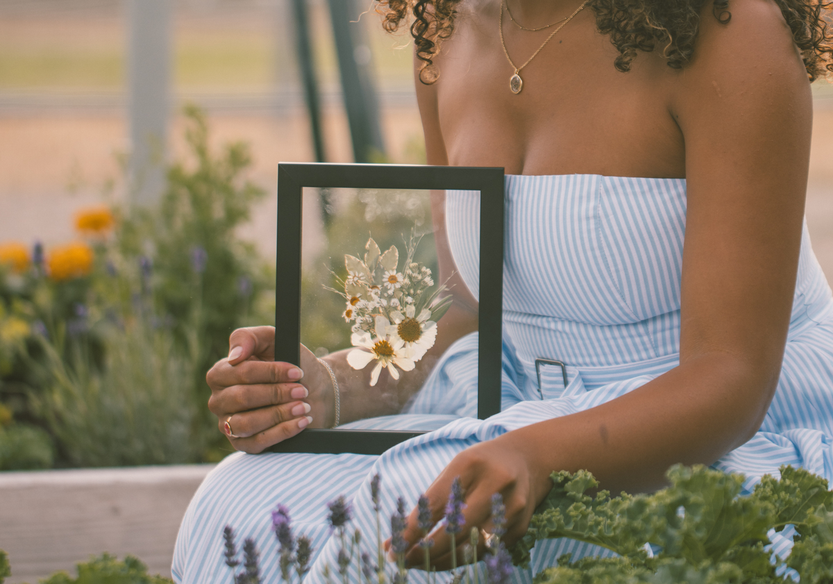 Pressed Floral boutonniere frame with delicate pressed flowers, designed for showcasing floral arrangements or corsages.