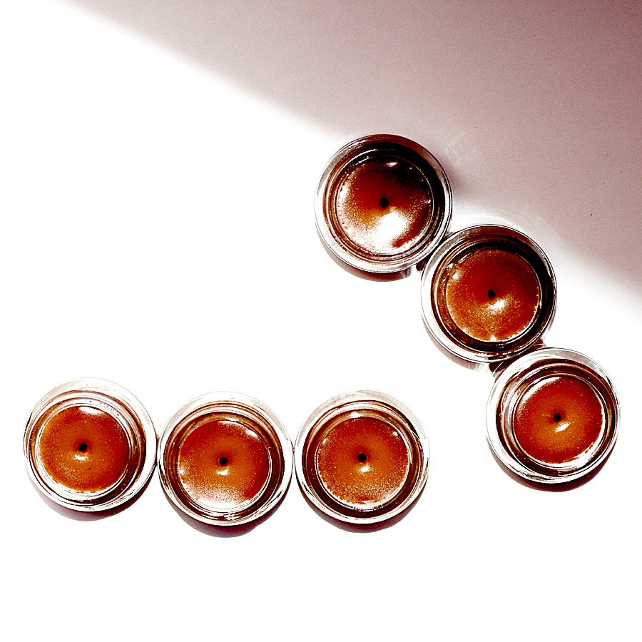 Plant Makeup cinnamon lip plumper showing a close-up of glossy, tinted lips with a subtle cinnamon hue and smooth texture.