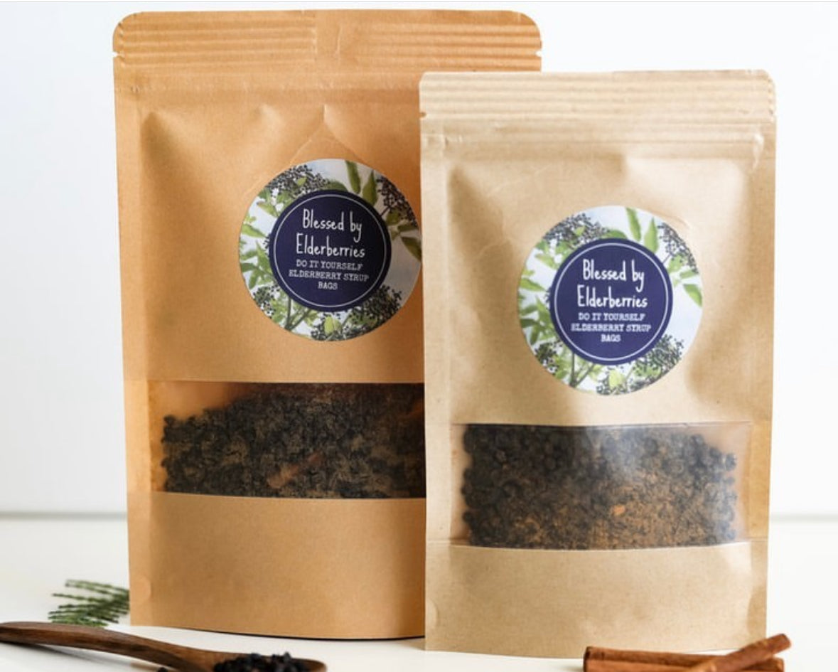DIY pint size elderberry syrup kit from Blessed by Elderberries with bottles, ingredients, and tools for homemade elderberry syrup.