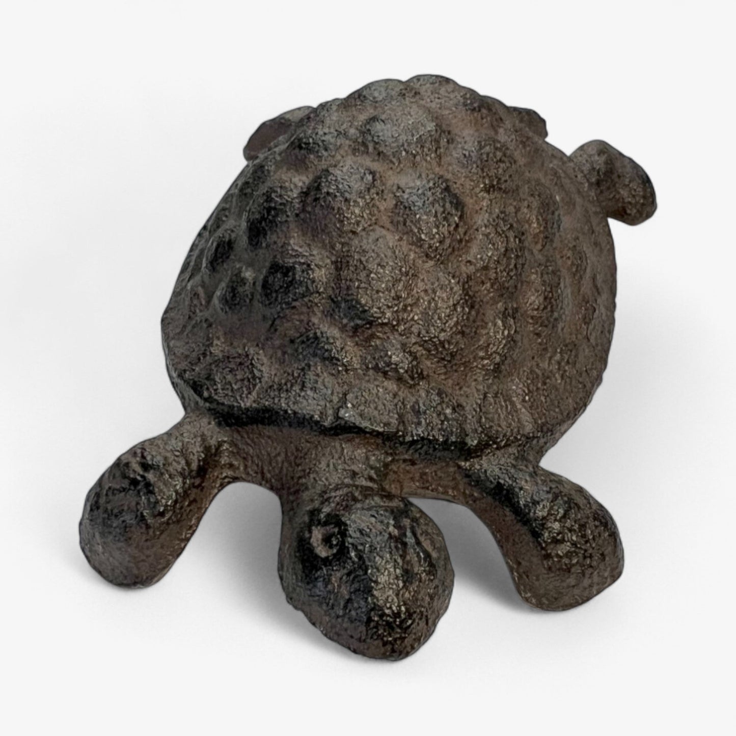 Rustic cast iron turtle garden statue by Iron & Blossom, weathered outdoor decor for whimsical garden decoration.