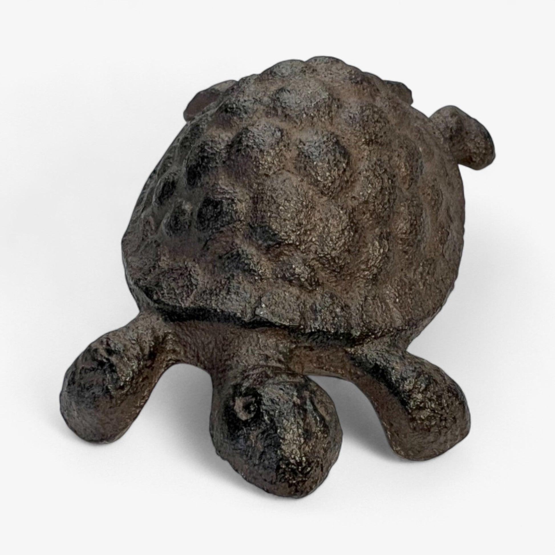 Rustic cast iron turtle garden statue by Iron & Blossom, weathered outdoor decor for whimsical garden decoration.