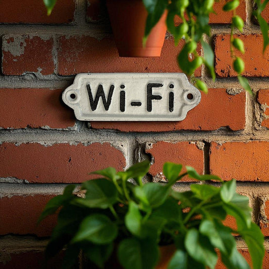 Vintage enamel Wi-Fi sign by Iron & Blossom, rustic home decor accent with a weathered metal finish and black Wi-Fi lettering.