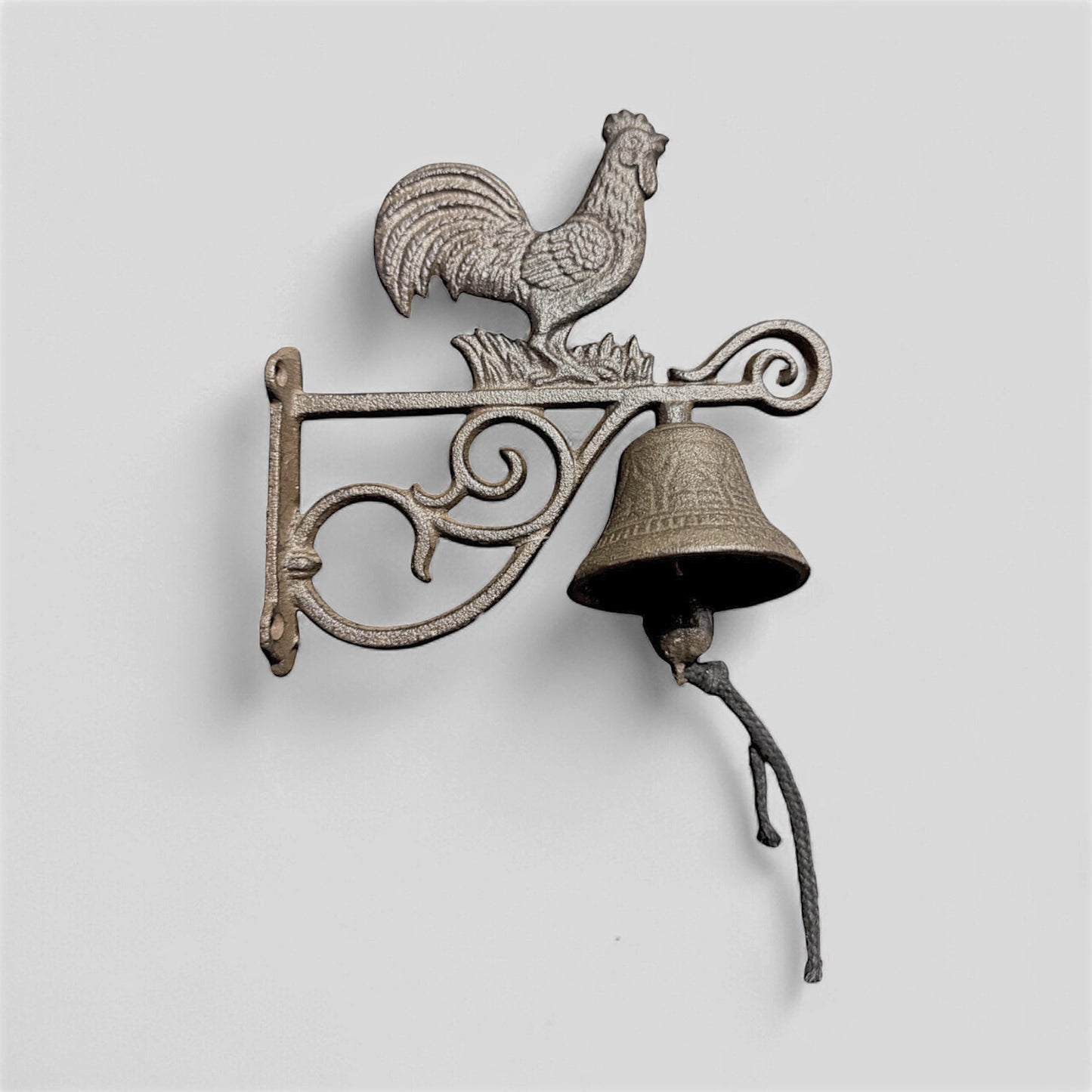 Rustic farmhouse cast iron rooster doorbell with countryside welcome chime by Iron & Blossom, mounted on wooden door.