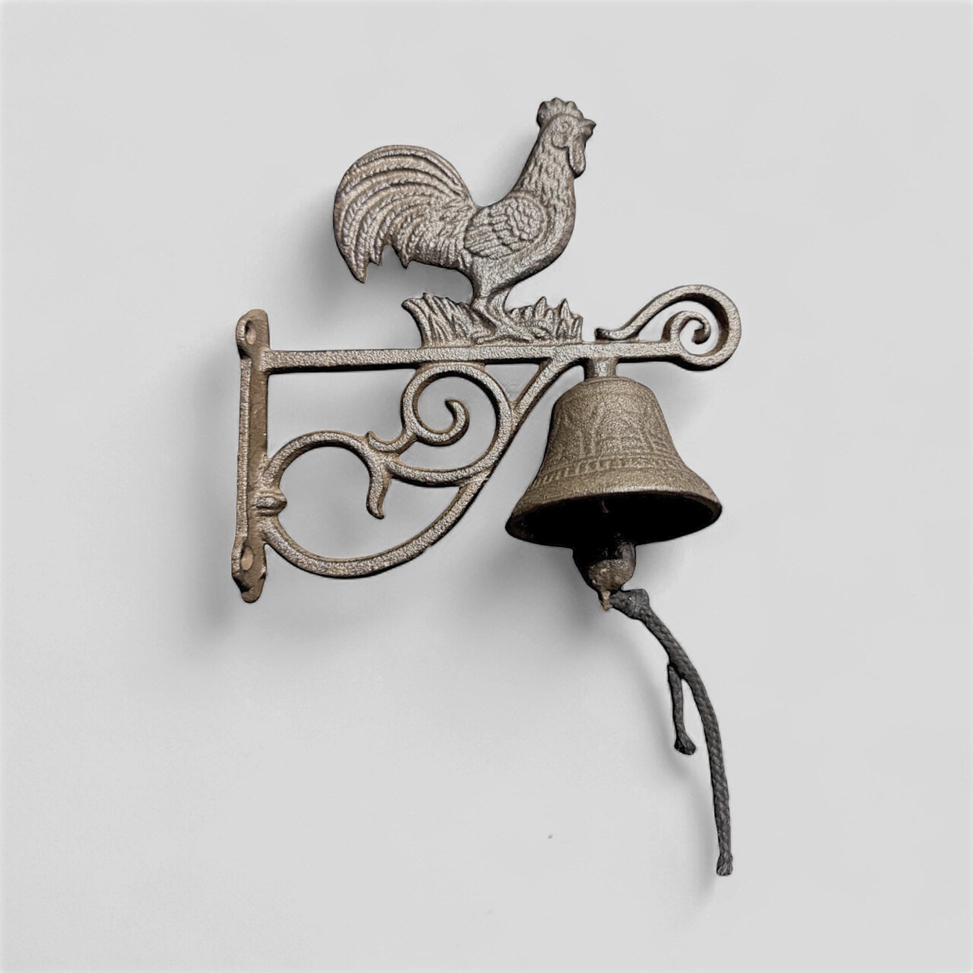 Rustic farmhouse cast iron rooster doorbell with countryside welcome chime by Iron & Blossom, mounted on wooden door.