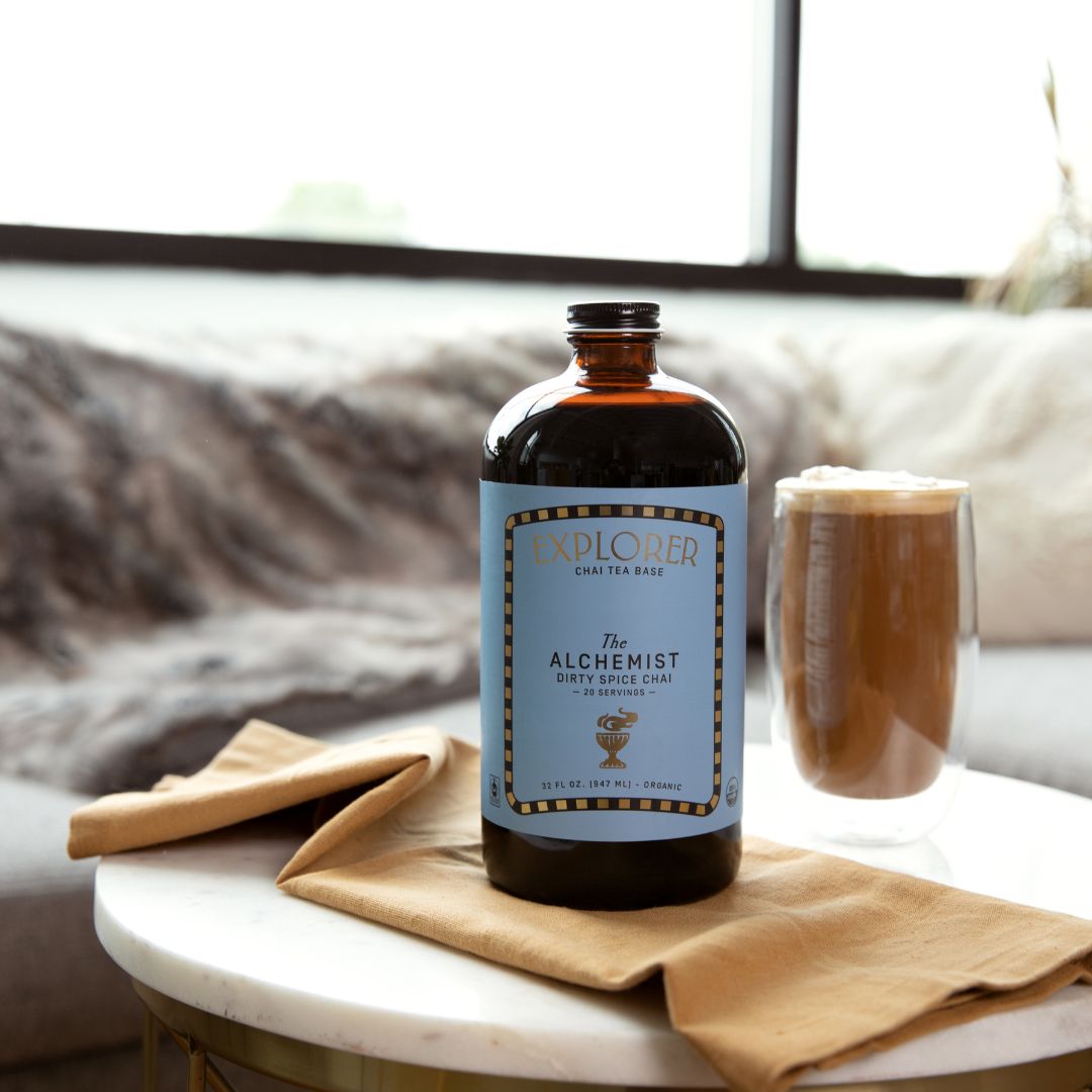 32oz Explorer Cold Brew chai concentrate bottle for tea and infusions, with a dark amber liquid visible inside.