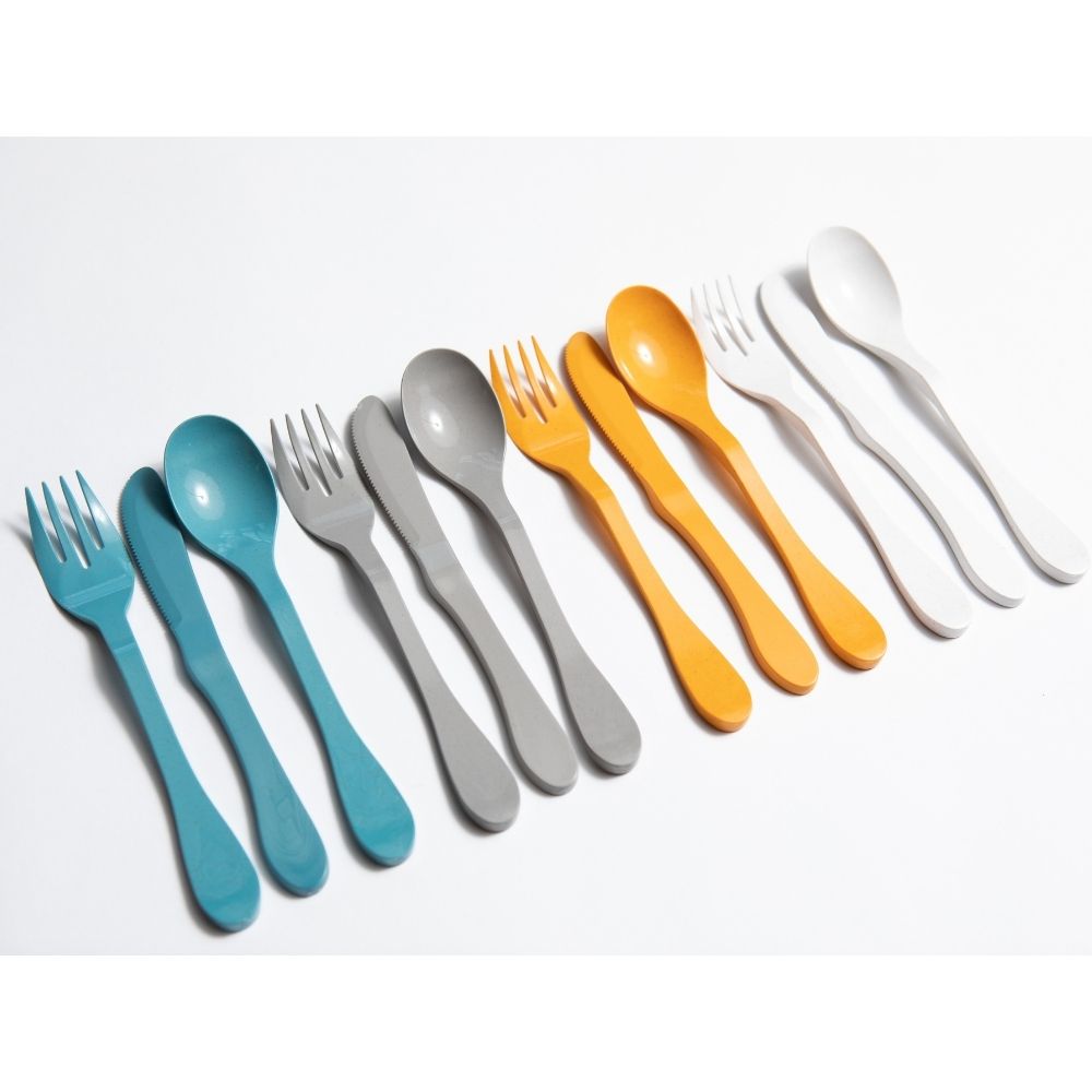 Set of 12 eco-friendly Knork fork, knife, and spoon utensils arranged on a white background.