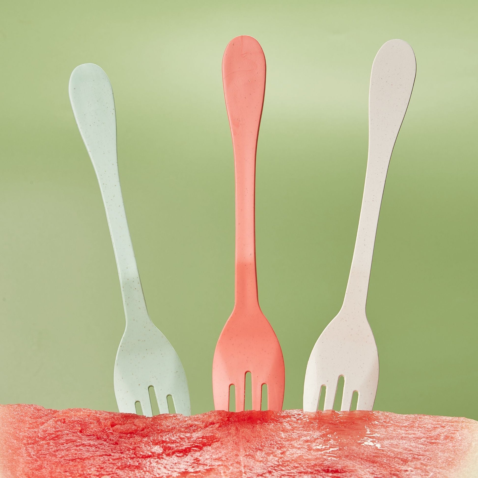 Set of 12 eco-friendly Knork utensils including forks, knives, and spoons arranged on a neutral background.