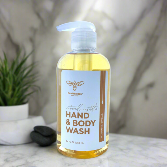 Organic Castile Hand and Body Wash by BannerBee Company LLC with citrus blossom scent, showcasing the product bottle and label.