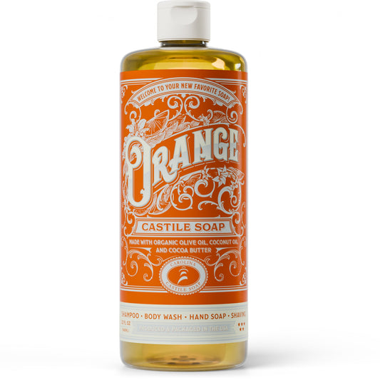 Bar of orange-scented Carolina Castile Soap with natural orange peel bits, showcasing a rustic soap bar on a neutral background.