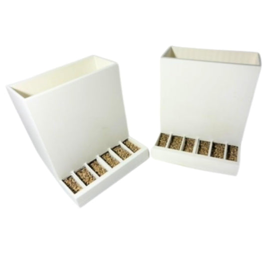 Pair of Quailz.com Button Quail Feeders with adjustable spill-resistant design for easy feeding of domesticated quails.