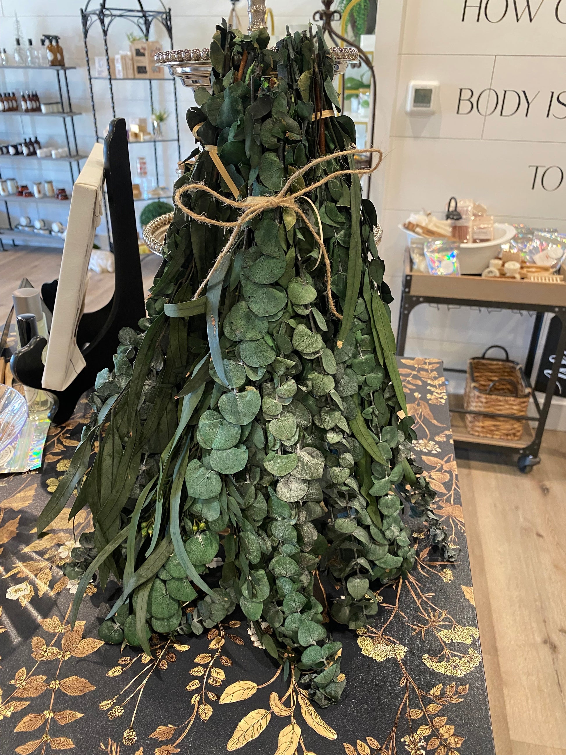 Hanging eucalyptus plant by Onic Brands LLC with lush green leaves and realistic appearance, ideal for home decor.