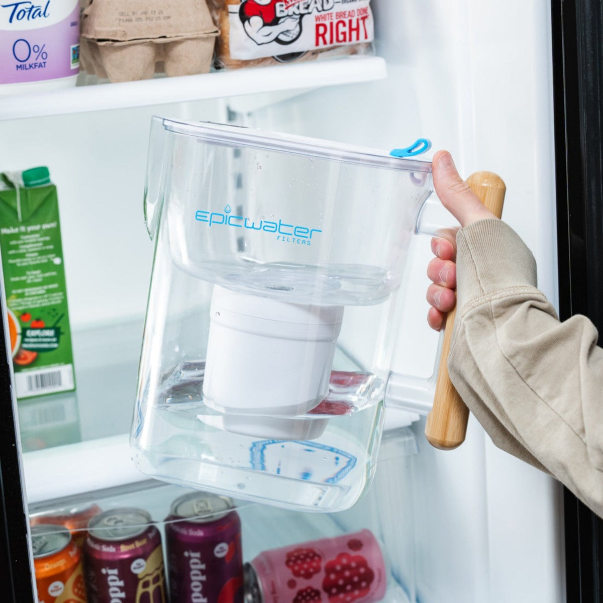 Epic Water Filters Pure XP Pitcher in red, designed to reduce fluoride, PFAS, and parasites for clean drinking water.