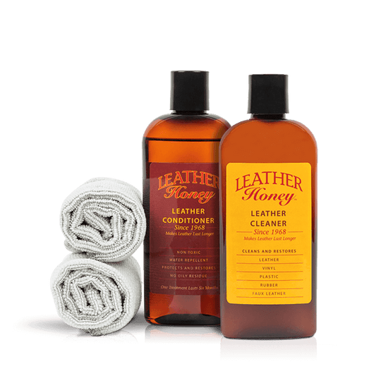 Leather Honey Leather Care Kit with 8oz conditioner, 8oz cleaner, and cleaning cloth for maintaining leather furniture and accessories.