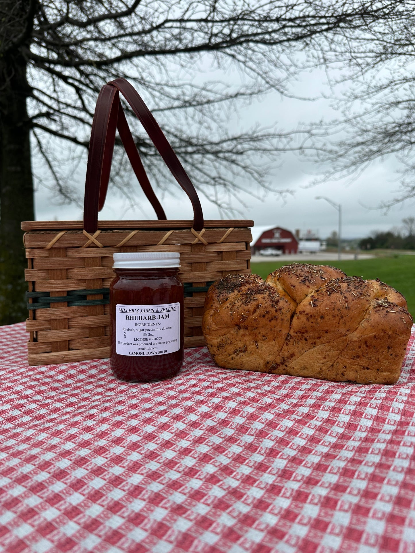 Amish Country Store Miller's Rhubarb Jam jar showcasing vibrant rhubarb-filled Amish jam on a rustic wooden table