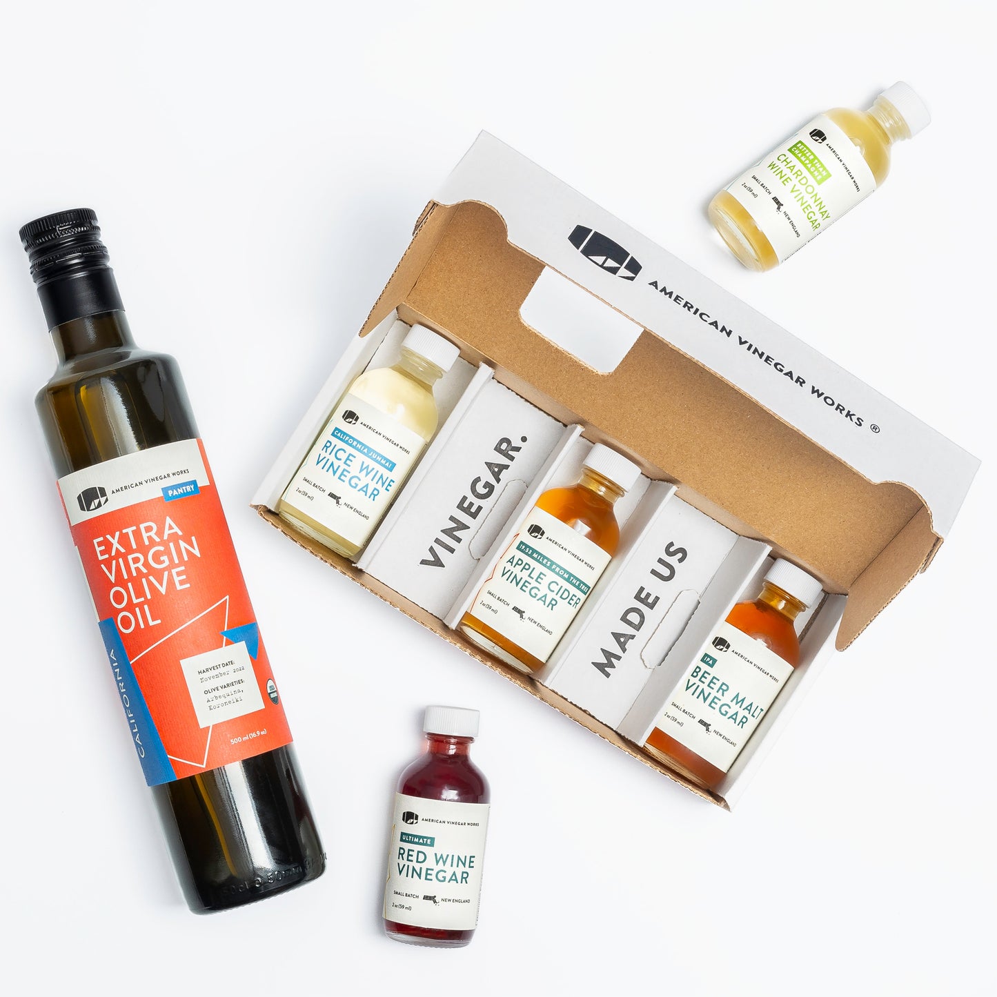 Mini American Vinegar Works oil and vinegar sampler with small bottles of various flavorful vinegars and oils.