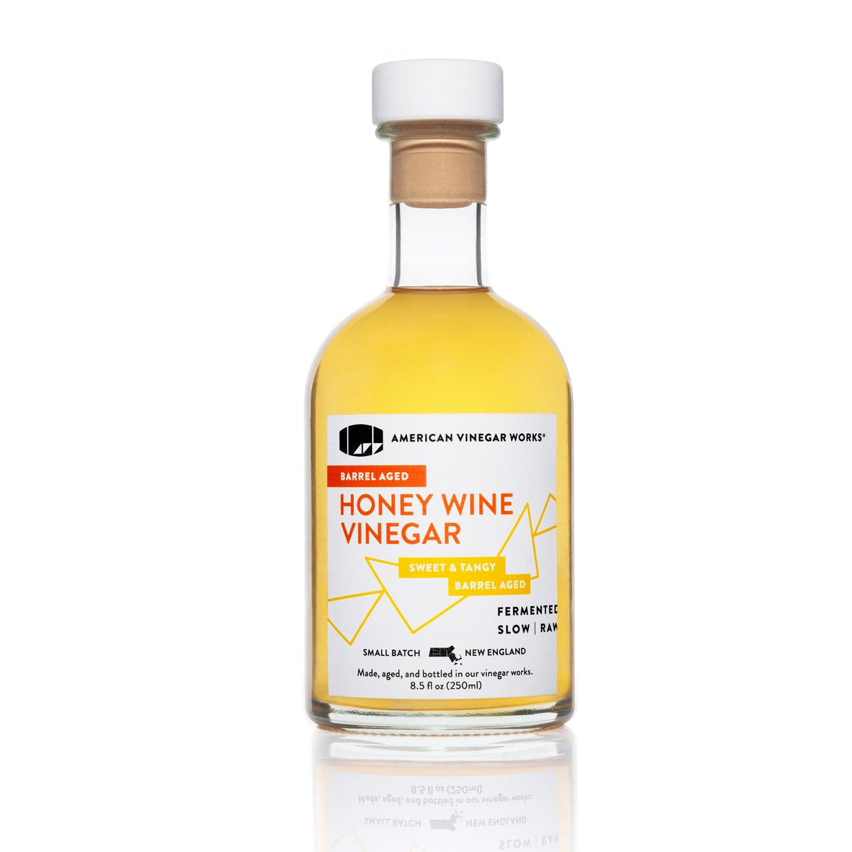 American Vinegar Works honey wine vinegar bottle with new label, showcasing its golden color and original honey-infused flavor.