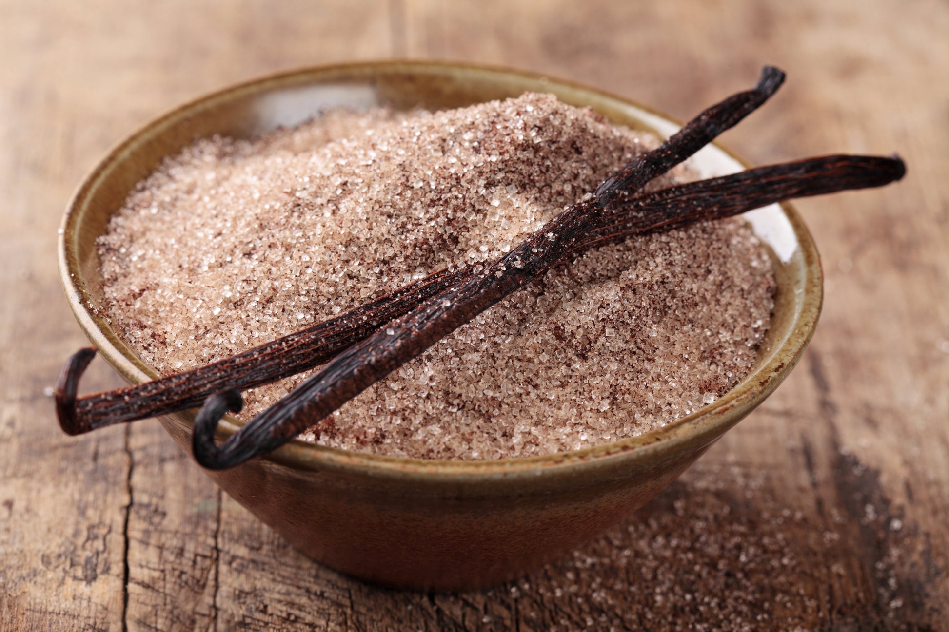 Organic vanilla bean sugar by Vanilla Bean Kings in a 12 oz jar, featuring vanilla beans and sugar blend in a clear container.