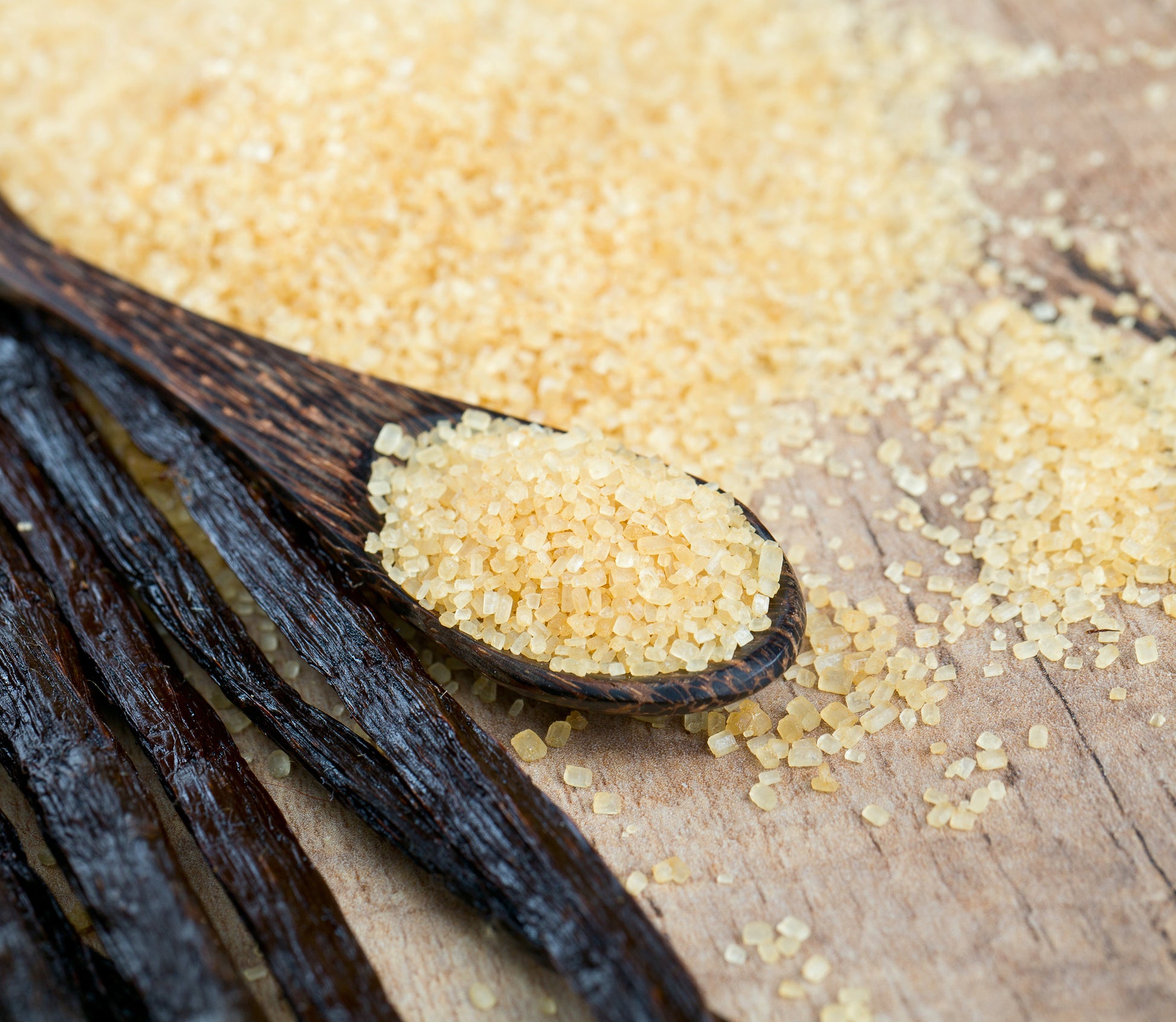 Organic vanilla bean sugar from Vanilla Bean Kings in a 12 oz jar, showing the sugar with vanilla bean specks.