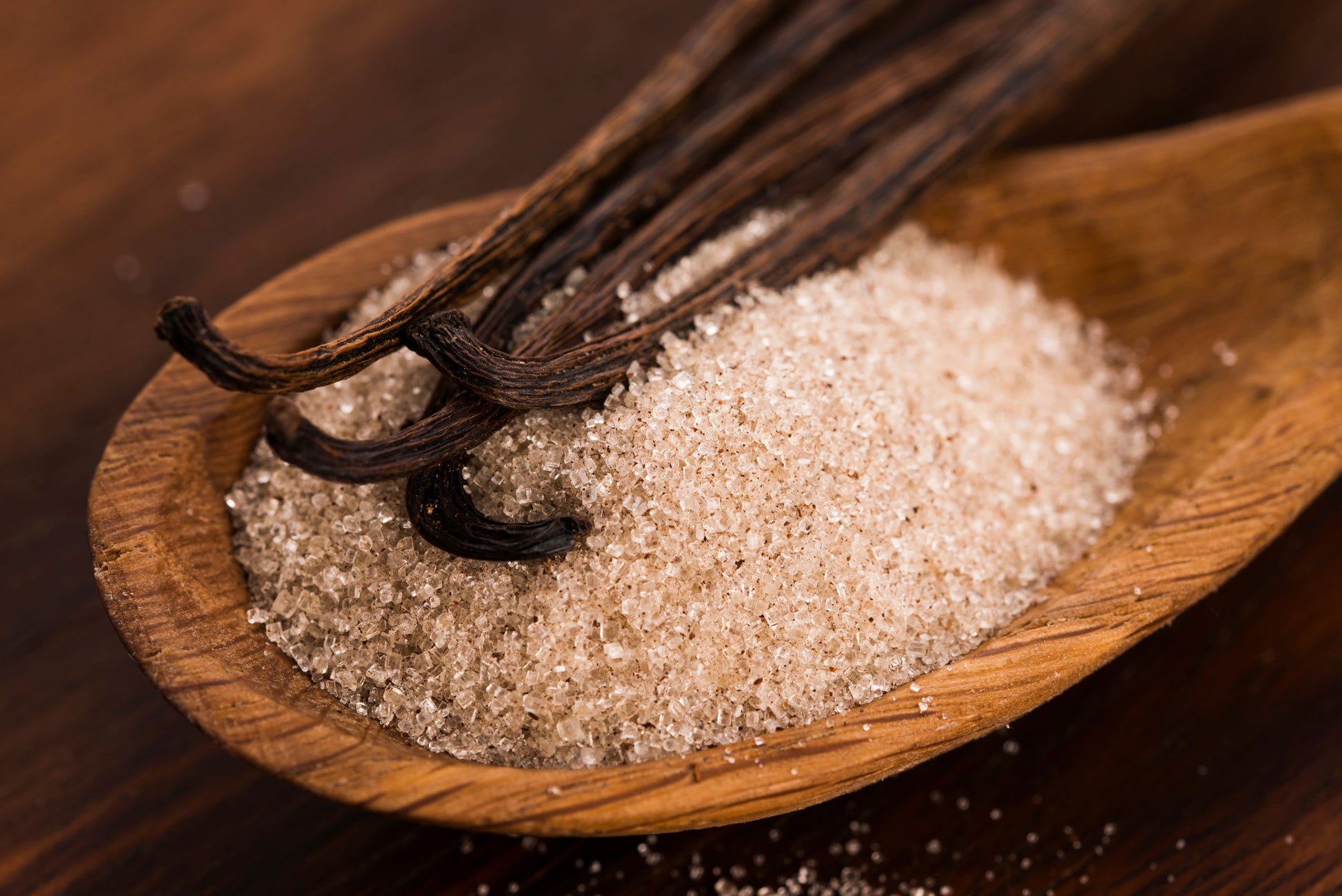 Organic vanilla bean sugar from Vanilla Bean Kings in a 12 oz jar, showcasing the vanilla beans and sugar blend.