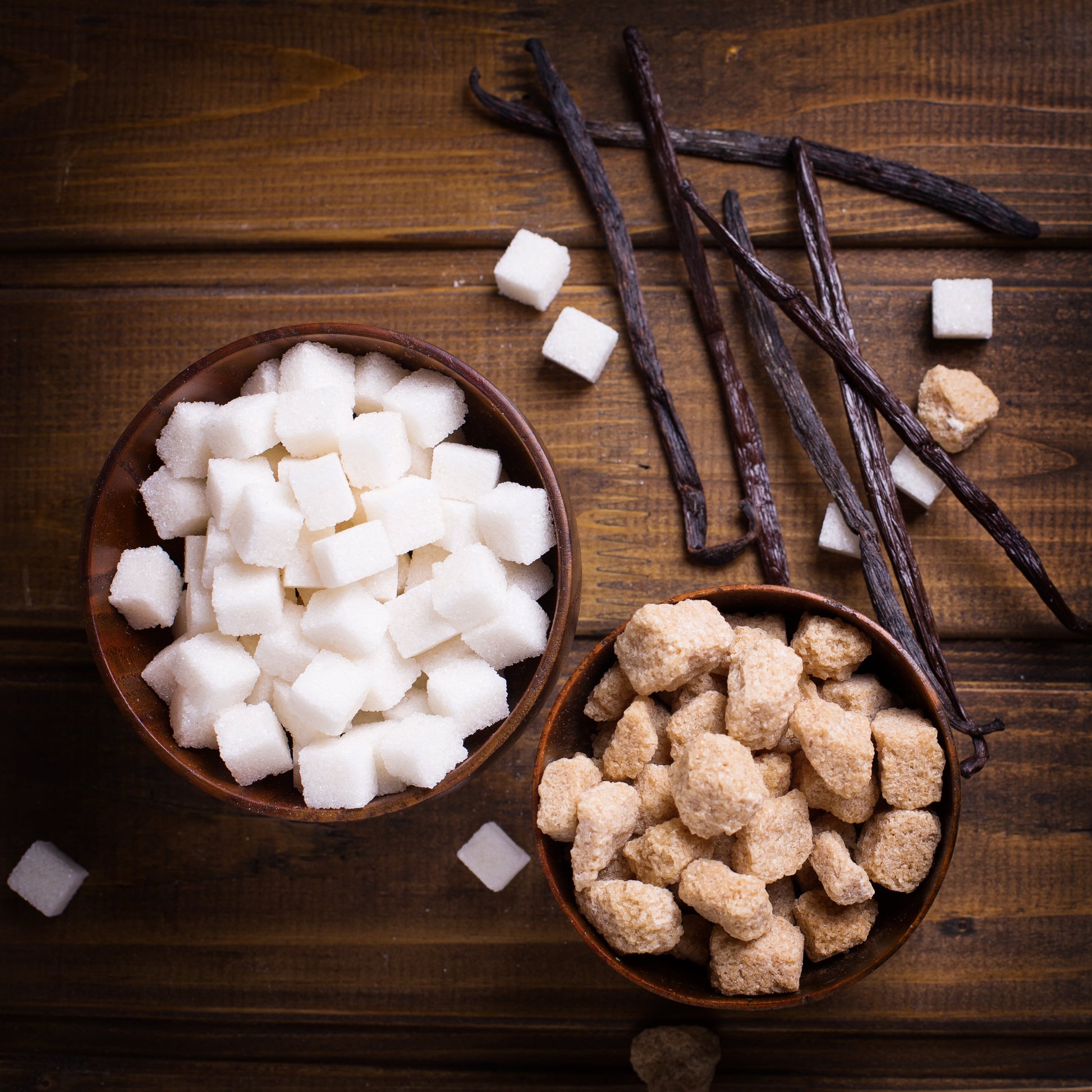 Organic vanilla bean sugar in a 12 oz jar from Vanilla Bean Kings, featuring visible vanilla bean specks and a clear label.