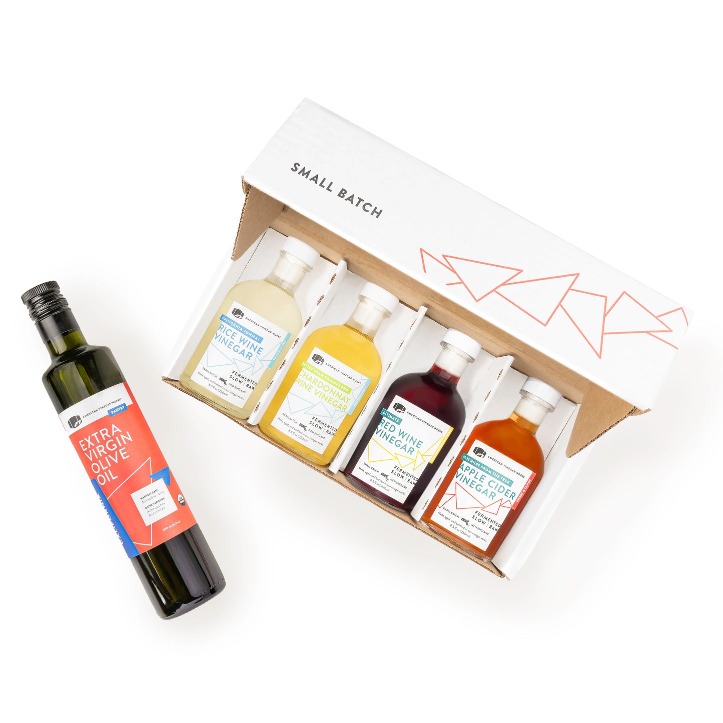 Small batch American Vinegar Works gift set featuring assorted kitchen and cooking vinegars in glass bottles.