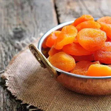 Dried Turkish apricots from Onic Brands LLC, showing vibrant orange, wrinkled apricots in a close-up image.
