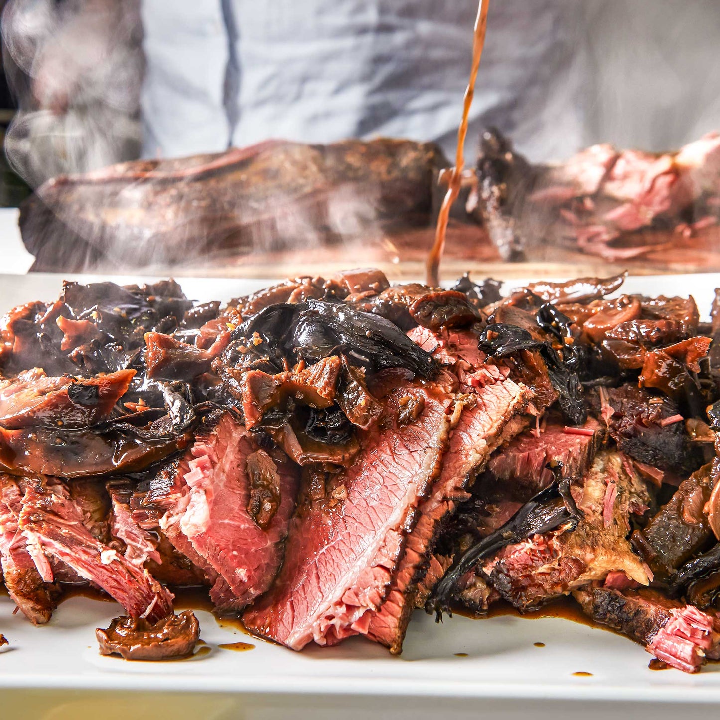 Slow smoked BBQ brisket by Pig of the Month BBQ, showcasing tender, flavorful, award-winning smoked beef brisket.