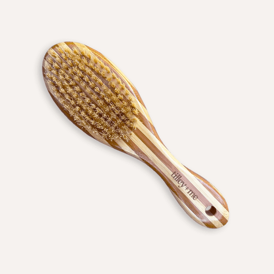 Two-sided pet grooming brush with bristle and wire sides for shedding and detangling, made by Tilley + Me for dogs.