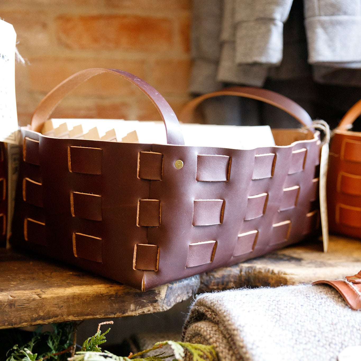 Large woven leather basket in chocolate brown by The Local Branch, showcasing a sturdy, handcrafted USA-made leather storage basket.