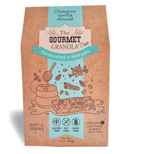 Birds perched on branches with a box of Cinnamon Vanilla Almond Granola Bars from BuyNebraska.com, gluten, dairy, and soy free.