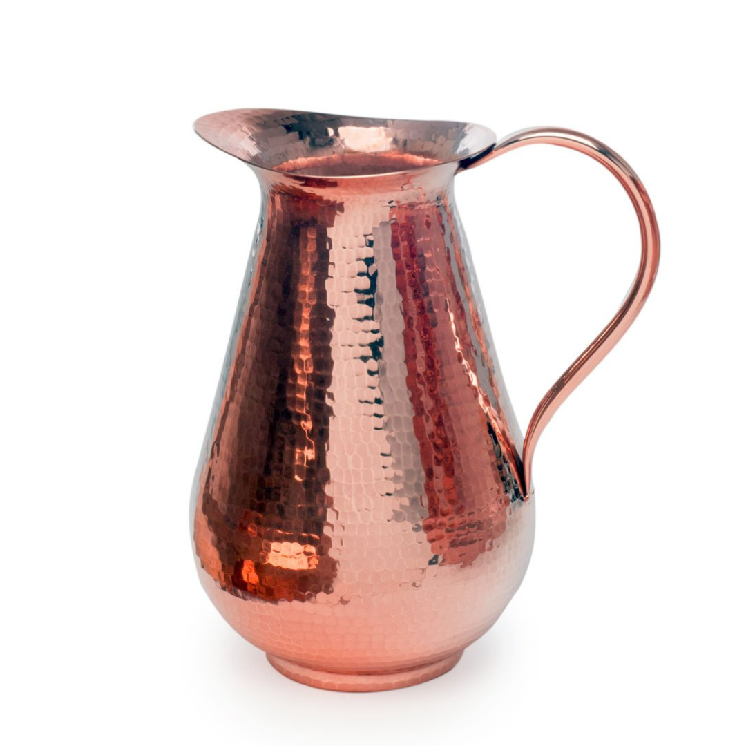 Sertodo Bisotun copper water pitcher with a rounded body and elegant handle, showcasing traditional craftsmanship and shiny finish.