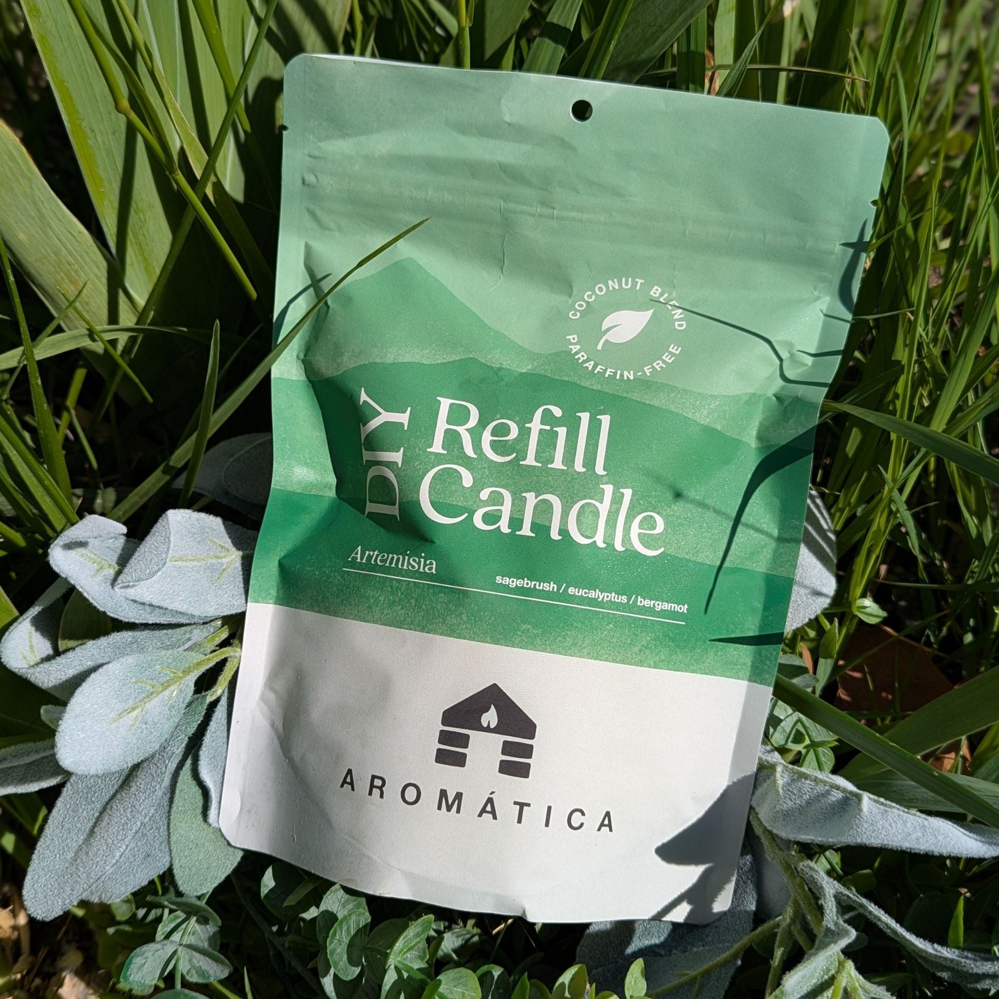 Bluecorn Candles Aromática scented candle refill kit with coconut wax, featuring a decorative candle and Artemisia accents.